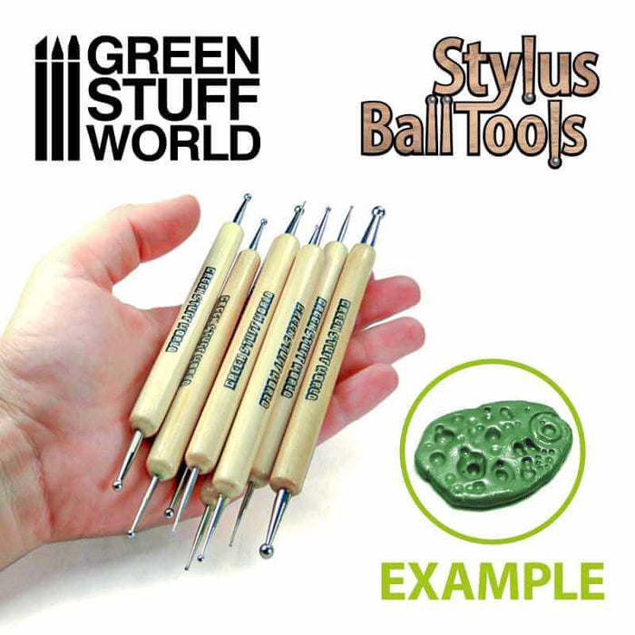 Hand holding 8 metall ball stylus sculpting tools and an example of them in use