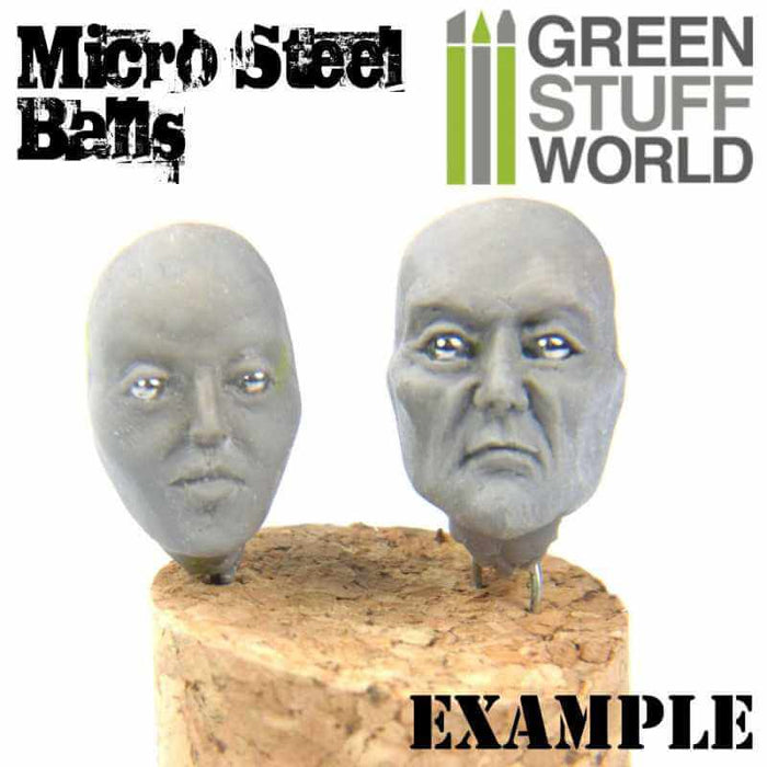 Two model heads with micro steel balls as eyes.